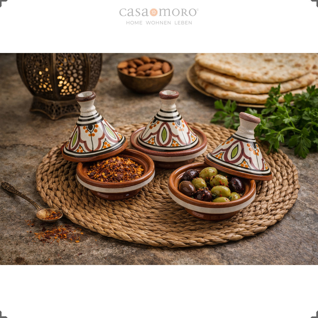 spice Tajine made of clay in a set of 3, hand-painted ceramic spice containers with olives and spices in an oriental ambience