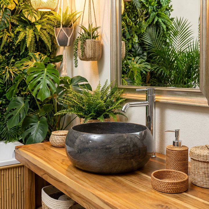 Round Washbasin Stone on wooden vanity in green spa bathroom with plant wall, mirror and warm light