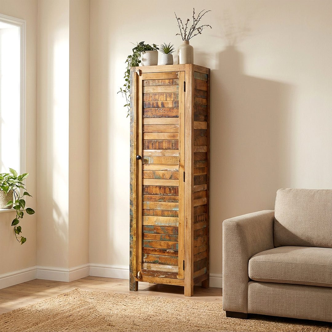 Narrow tall cabinet made of solid wood and reclaimed wood in vintage style, placed in the living room