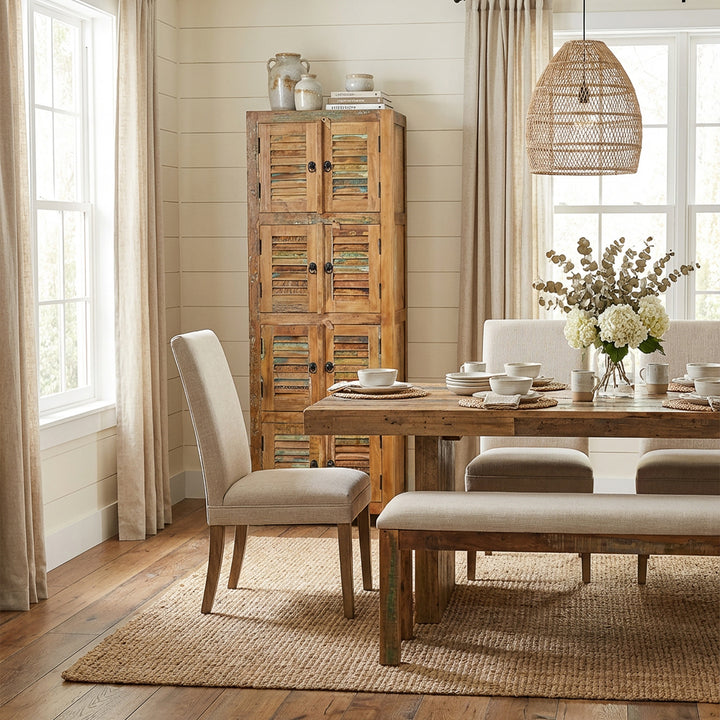 Cabinet made of solid wood and reclaimed wood in a country house style, placed in the dining room
