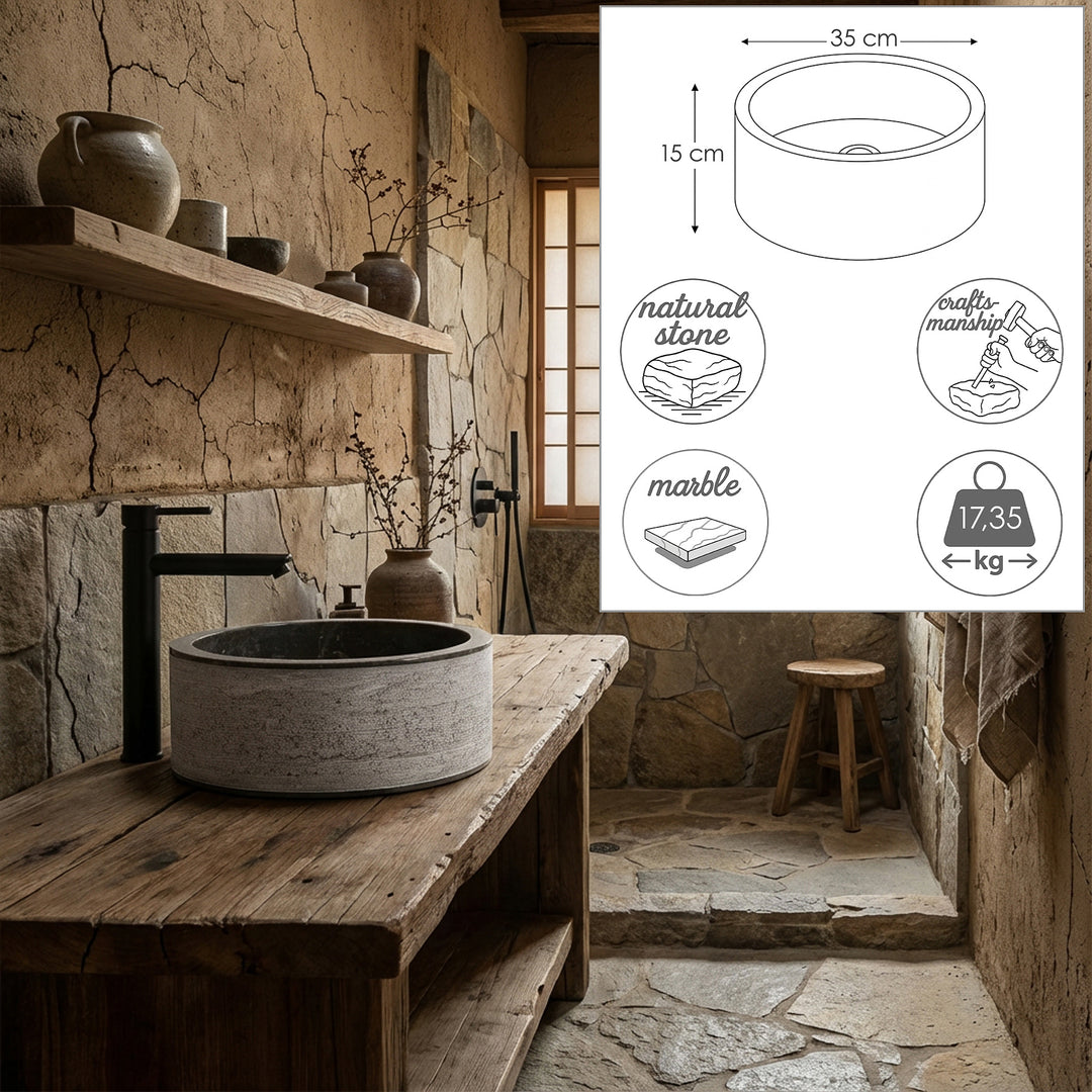 Round stone washbasin on a rustic wooden table with dimensional graphics and material symbols, staged in a quiet natural bathroom.