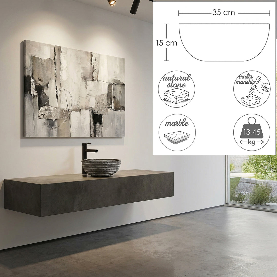 Round countertop washbasin made of marble on a floating washbasin in a modern bathroom with integrated dimensional graphics