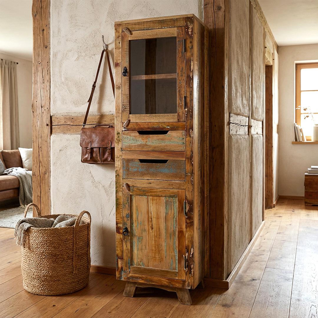 Tall cabinet made of solid wood and reclaimed wood with drawer and doors in vintage style, placed in the hallway